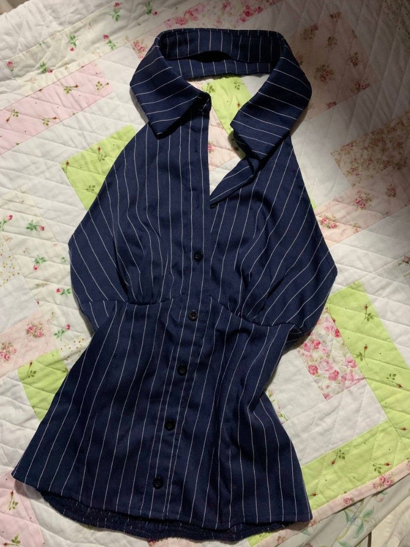 SHEIN Navy Blue Pinstripe Collared Halter Top (Category: Sleeveless) located in Paranaque City. Submitted by dayiiee (Listing ID 1469674838, Image 1). Description: Navy blue pinstripe top featuring a classic collar, button-down front, and a fitted waist for a chic and classy look. Perfect for casual wear or dressing up..