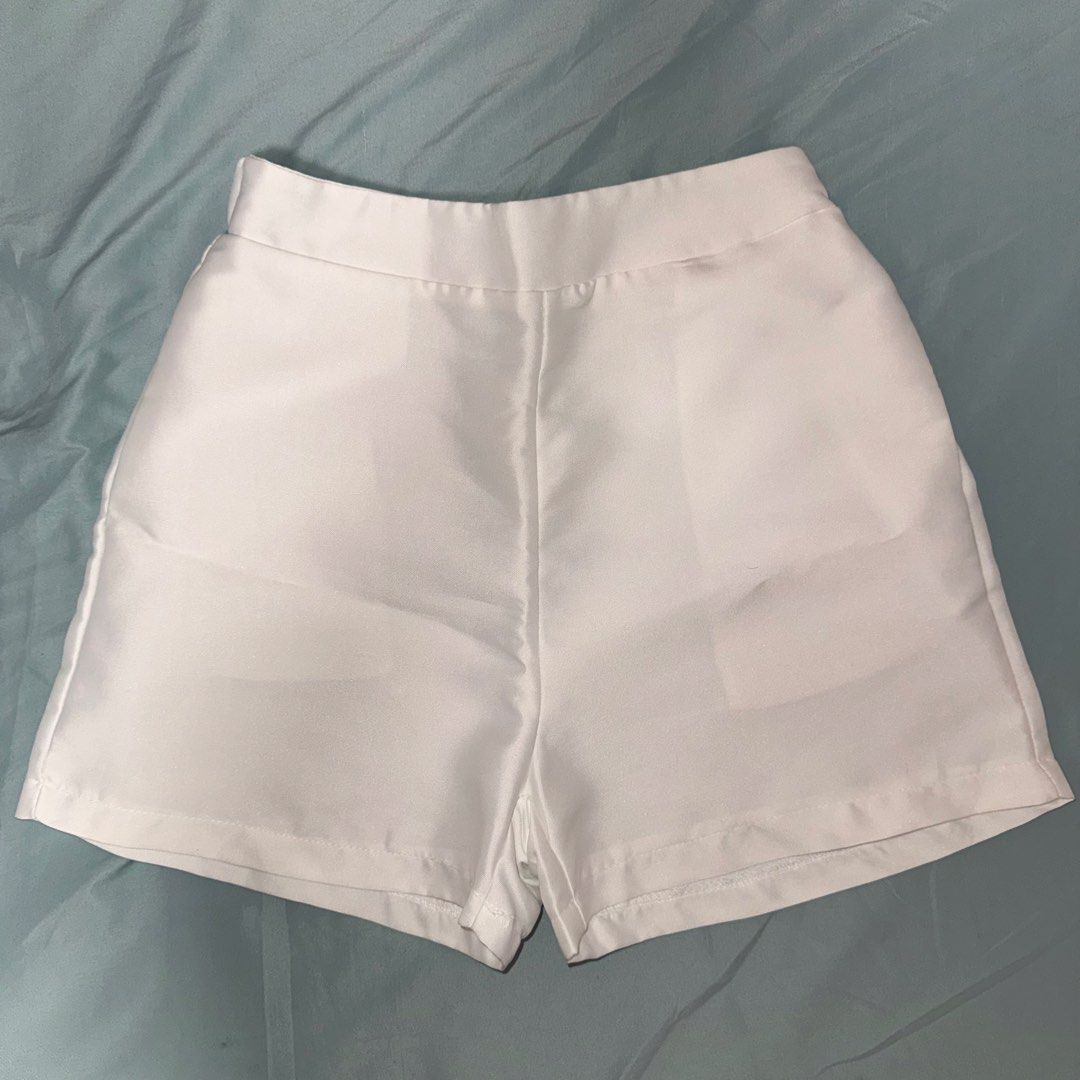 Silk Shorts from Vietnam (Category: Shorts) located in Paranaque City. Submitted by lovedbyblanche (Listing ID 1469616464, Image 1). Description: - Color: Plain white - Style: High-waisted with a clean solid design and straight cut hem - Material: Soft fabric with a bit of stretch - Measurements: 12 inches across flat (waist), 13 inches total length - Features: Great versatile basic, easy to mix and match for warm weather outfits - Garthherized b