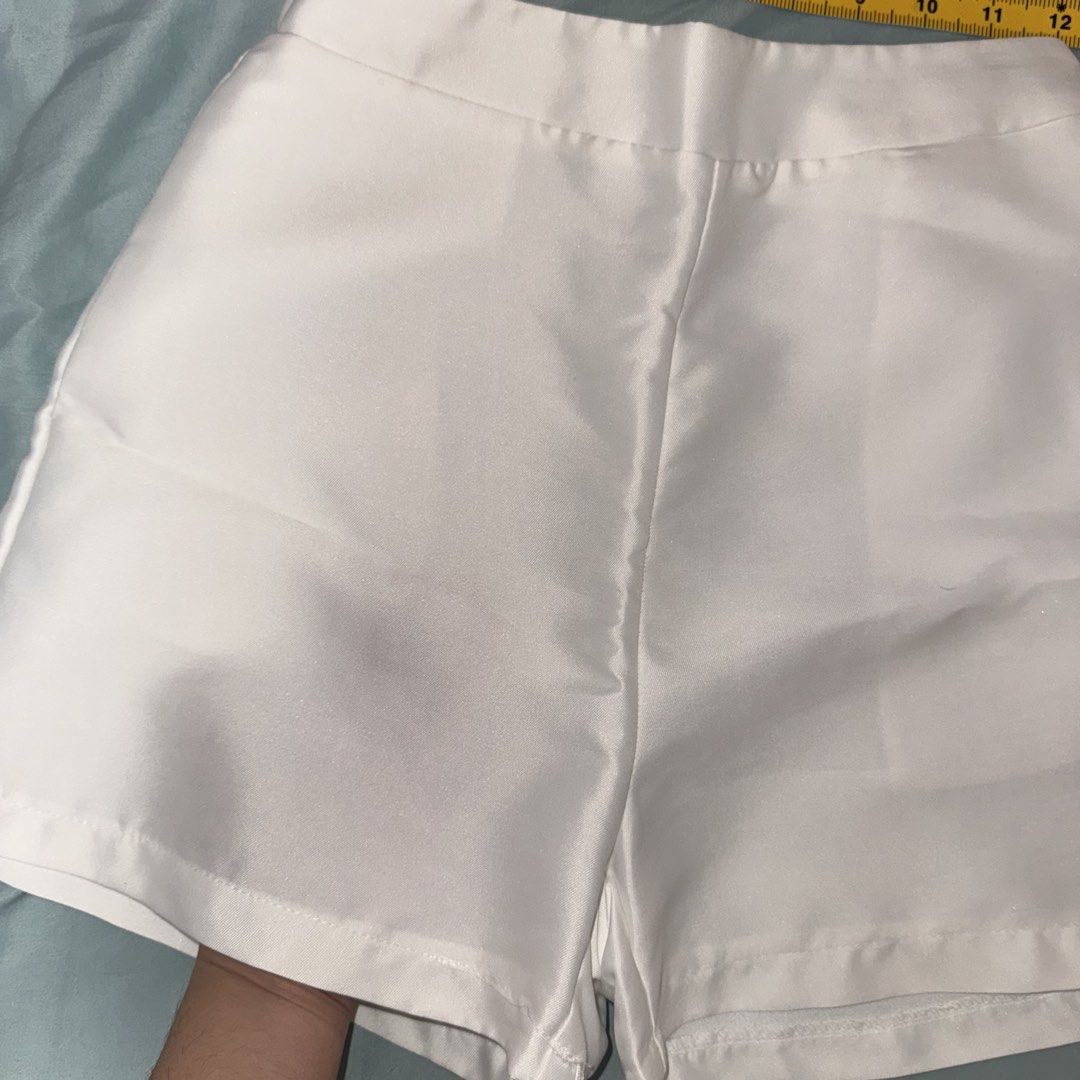 Silk Shorts from Vietnam (Category: Shorts) located in Paranaque City. Submitted by lovedbyblanche (Listing ID 1469616464, Image 3). Description: - Color: Plain white - Style: High-waisted with a clean solid design and straight cut hem - Material: Soft fabric with a bit of stretch - Measurements: 12 inches across flat (waist), 13 inches total length - Features: Great versatile basic, easy to mix and match for warm weather outfits - Garthherized b