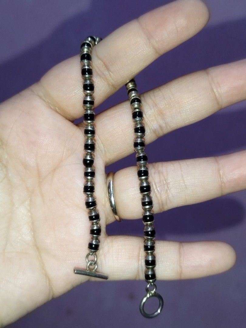 Silver 925 Black and Silver Beaded Toggle Bracelet (Category: Bracelets) located in Manila. Submitted by Cie28 (Listing ID 1469720753, Image 2). Description: - Material: Hallmarked 925 Sterling Silver - Design: Alternating black beads and silver spacers - Closure: T-bar toggle clasp - Fit: Standard wrist length, 8 inches - Condition: Clean finish, beads intact.
