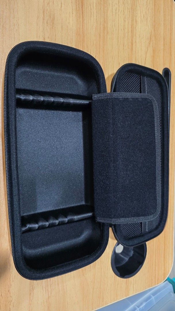 Skull & Co. Hard Carrying Case for Nintendo Switch (Category: Cases & Covers) located in Caloocan City. Submitted by FlexiMart (Listing ID 1469655498, Image 3). Description: - Authentic Skull & Co. hard carrying case (Black) - Rugged outer shell for maximum travel protection - Built-in game card slots and zippered mesh pocket for accessories - Padded interior divider to prevent screen scratches - Sturdy rubber top handle for convenient carrying.