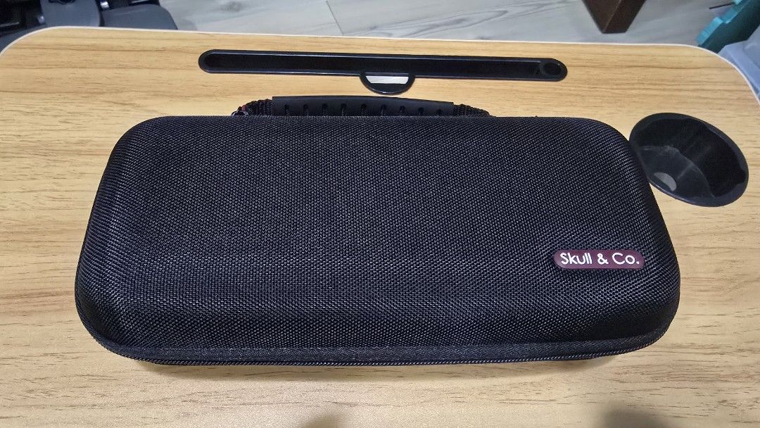 Skull & Co. Hard Carrying Case for Nintendo Switch (Category: Cases & Covers) located in Caloocan City. Submitted by FlexiMart (Listing ID 1469655498, Image 1). Description: - Authentic Skull & Co. hard carrying case (Black) - Rugged outer shell for maximum travel protection - Built-in game card slots and zippered mesh pocket for accessories - Padded interior divider to prevent screen scratches - Sturdy rubber top handle for convenient carrying.