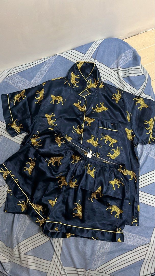 Sleep wear (Category: Undergarments & Loungewear) located in Makati City. Submitted by bossdonna (Listing ID 1469707381, Image 3). Description: - 3 stylish designs: White with black hearts, pink & black vertical stripes, navy blue with gold cheetah print - Set includes: Short-sleeve button-up top with lapel collar and chest pocket, plus matching shorts - Comfort fit: Elastic waistband on shorts for easy wear - Material: Soft, lightweight fabric i