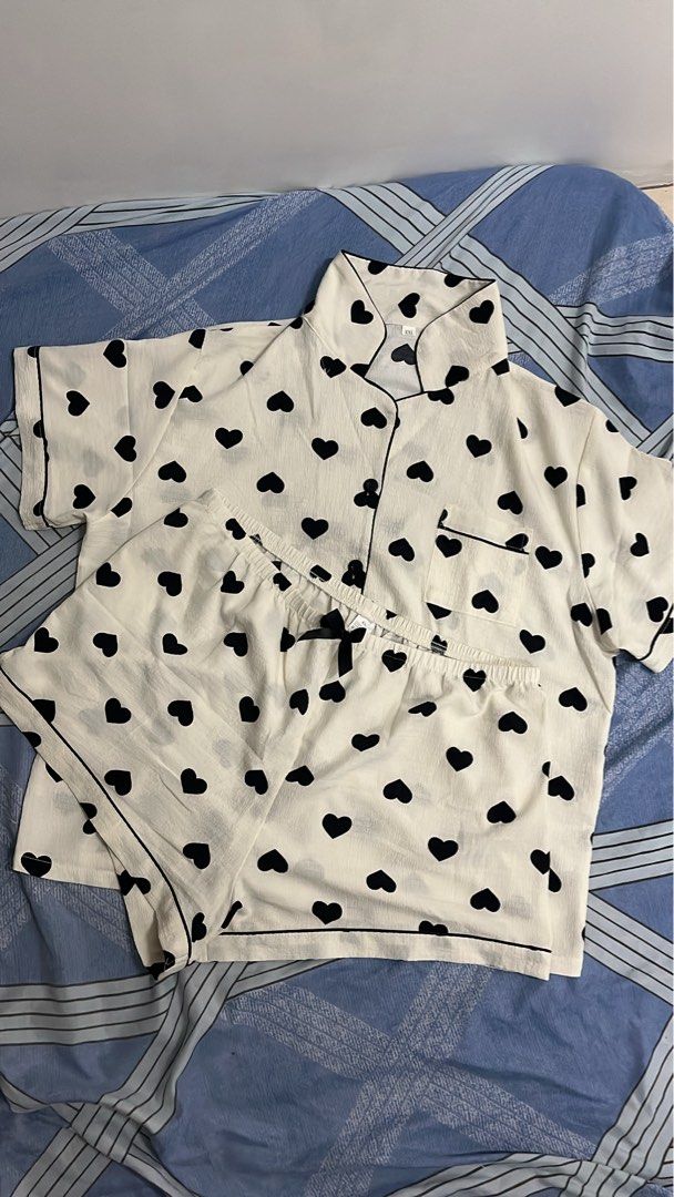 Sleep wear (Category: Undergarments & Loungewear) located in Makati City. Submitted by bossdonna (Listing ID 1469707381, Image 1). Description: - 3 stylish designs: White with black hearts, pink & black vertical stripes, navy blue with gold cheetah print - Set includes: Short-sleeve button-up top with lapel collar and chest pocket, plus matching shorts - Comfort fit: Elastic waistband on shorts for easy wear - Material: Soft, lightweight fabric i