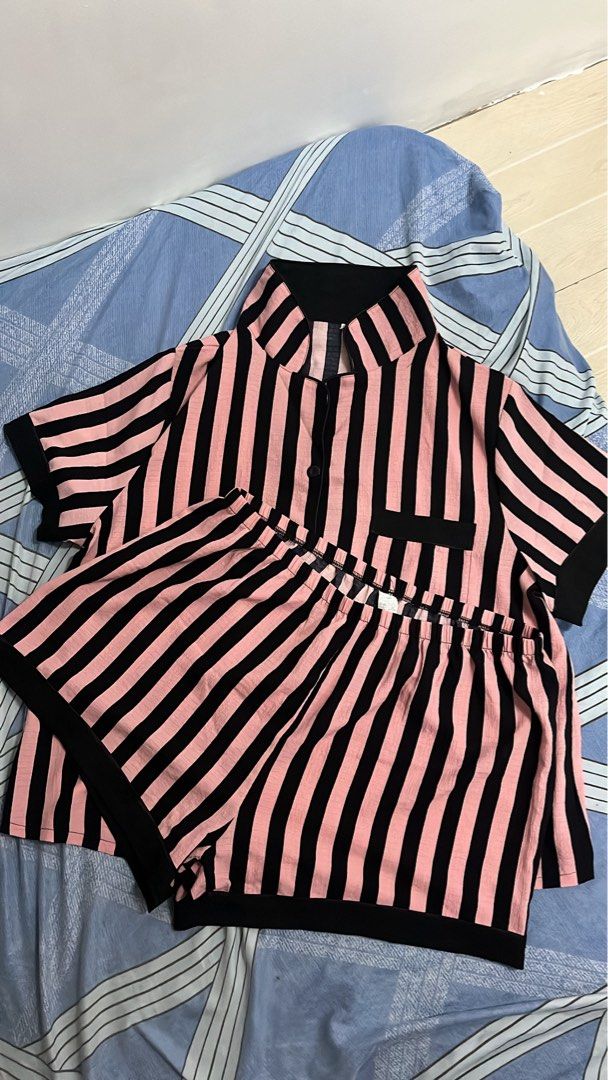 Sleep wear (Category: Undergarments & Loungewear) located in Makati City. Submitted by bossdonna (Listing ID 1469707381, Image 2). Description: - 3 stylish designs: White with black hearts, pink & black vertical stripes, navy blue with gold cheetah print - Set includes: Short-sleeve button-up top with lapel collar and chest pocket, plus matching shorts - Comfort fit: Elastic waistband on shorts for easy wear - Material: Soft, lightweight fabric i
