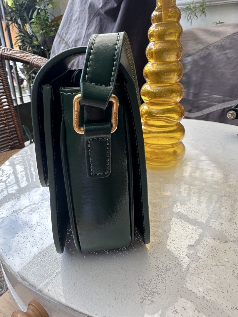 Sling bag (Category: Shoulder Bags) located in Manila. Submitted by joanparungao012022 (Listing ID 1469654308, Image 3). Description: Celine sling bag preloved bag * Color: green * Features: adjustable sling strap * Material: leather * Coded: yes * Zipper: none * This is a second hand bag please manage your expectations * Flaws: minimal sign of use * All bag are not-guaranteed (NGA) since it is bought from japan online seller * Its up to you to d