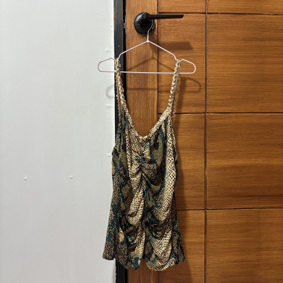Snake Print Camisole Top with Sequins (Category: Sleeveless) located in Tuguegarao City. Submitted by shopaholiccccs (Listing ID 1469625817, Image 1). Description: small to med - Trendy mix of snake and leopard animal prints - Eye-catching shimmery gold sequin straps and V-neckline trim - Flattering ruched front design with center gathering - Comfortable, stretchy fabric with a sleeveless cut - Perfect statement piece for parties, clubs, and nigh