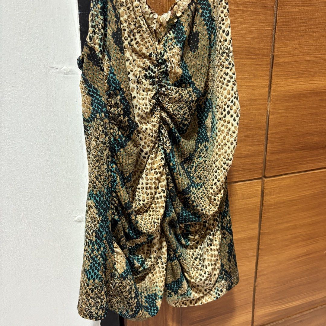 Snake Print Camisole Top with Sequins (Category: Sleeveless) located in Tuguegarao City. Submitted by shopaholiccccs (Listing ID 1469625817, Image 3). Description: small to med - Trendy mix of snake and leopard animal prints - Eye-catching shimmery gold sequin straps and V-neckline trim - Flattering ruched front design with center gathering - Comfortable, stretchy fabric with a sleeveless cut - Perfect statement piece for parties, clubs, and nigh