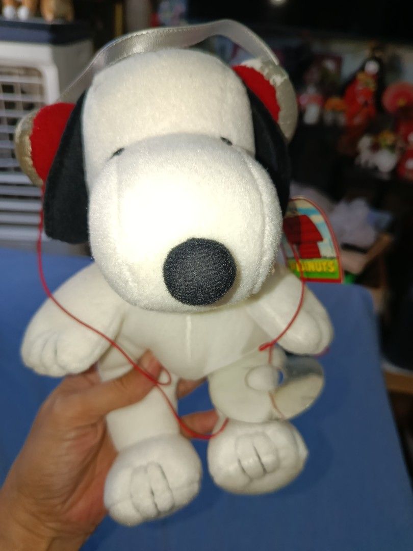 Snoopy peanuts with headphone still with tag (Category: Plushies & Soft Toys) located in Quezon City. Submitted by kristal68 (Listing ID 1469579442, Image 3). Description: slightly faded headphone.