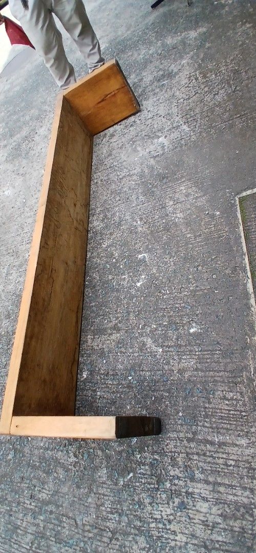 Solid Wood Bench Long Low Bench (Category: Chairs) located in Marikina City. Submitted by darthvader888 (Listing ID 1469612744, Image 2). Description: - Type: Long wooden bench with sturdy integrated legs - Finish: Natural wood grain with minor visible wear from normal use - Dimensions: Roughly 71 inches long x 15 inches tall - Build: Heavy and very stable - Ideal Use: Great as an entryway seat or long coffee table.