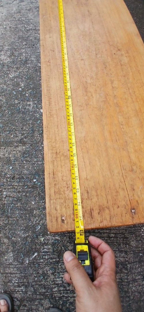 Solid Wood Bench Long Low Bench (Category: Chairs) located in Marikina City. Submitted by darthvader888 (Listing ID 1469612744, Image 3). Description: - Type: Long wooden bench with sturdy integrated legs - Finish: Natural wood grain with minor visible wear from normal use - Dimensions: Roughly 71 inches long x 15 inches tall - Build: Heavy and very stable - Ideal Use: Great as an entryway seat or long coffee table.