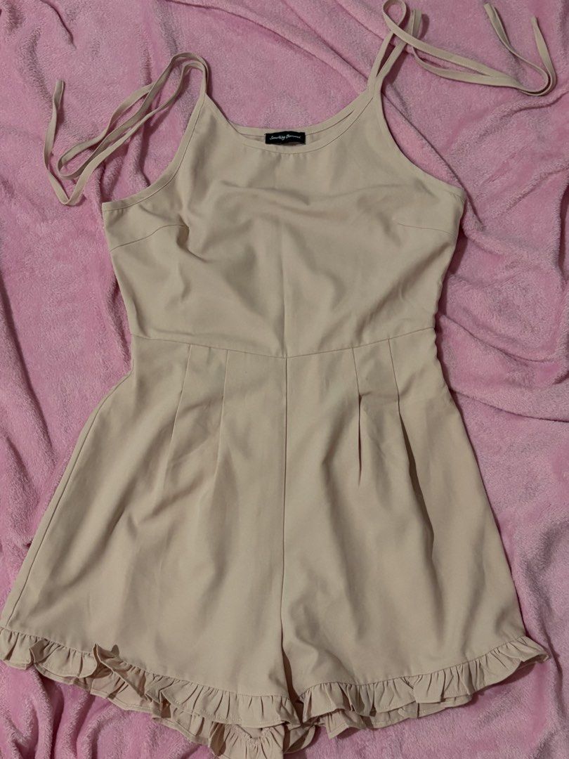 Something Borrowed Light Pink Ruffle Hem Romper (Category: Rompers) located in Nagcarlan. Submitted by nkkva (Listing ID 1469688985, Image 1). Description: - Brand: Something Borrowed - Color: Light Pink - Style: Romper with cute ruffle hem - Straps: Adjustable tie shoulder straps - Fabric: Lightweight and perfect for warm weather - Condition: Worn only a few times, wardrobe clear-out.