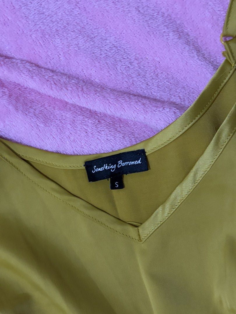 Something Borrowed Mustard Yellow Satin Romper Size S (Category: Rompers) located in Nagcarlan. Submitted by nkkva (Listing ID 1469692243, Image 2). Description: - Brand: Something Borrowed - Size: Small - Color: Mustard Yellow - Material: Smooth satin with a slight sheen - Style: V-neckline with adjustable spaghetti straps, fitted waist, and pleated shorts.