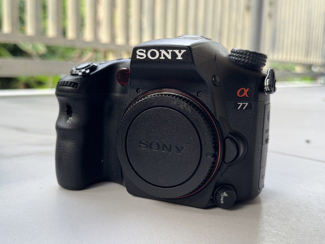 Sony Alpha 77 Camera with Lenses and Flashes Bundle (Category: Cameras) located in Marikina City. Submitted by ranmaonli59955 (Listing ID 1469691674, Image 2). Description: - Complete Sony Alpha 77 camera kit, ready to shoot - Includes camera body, two lenses (including an 80-200mm zoom), and two external flashes - Comes with wireless triggers, battery charger, and four batteries - Includes protective lens pouches and camera strap - Fully tested 