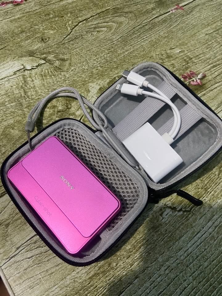 Sony Cyber-shot Pink Digital Camera with Case (Category: Cameras) located in Manila. Submitted by angell_dsartes (Listing ID 1469612911, Image 2). Description: - Pink Sony Cyber-shot compact digital camera - Fully tested: powers on and shoots with a clear screen - Compact and pocket-friendly size with a vibrant finish - Includes protective hard zip case, wrist strap, and multi-connector cable adapter - Ready to use right out of the case SONY CYBE