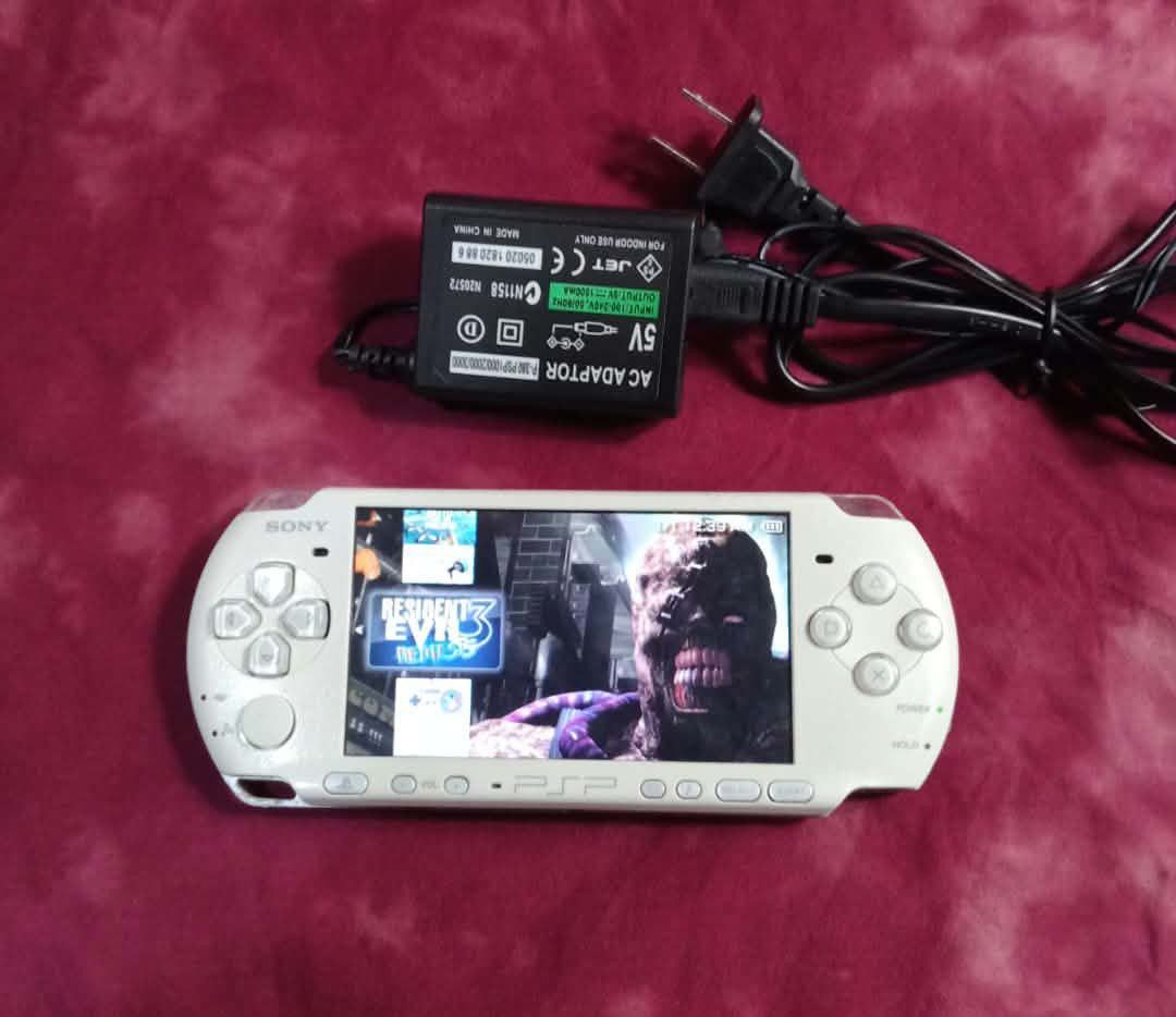 Sony PSP Pearl White 3004 model v3 (Category: PlayStation) located in Quezon City. Submitted by ydna_22 (Listing ID 1469666695, Image 3). Description: Sony PlayStation Portable 3004 model v3 slim pearl white ncludes intact original battery and memory card full of games.minimal scratch due to use. All bottons crisp fully working, screen shows gameplay clearly with menu operational.Analog stick no ghost movement. Great handheld for classic gaming o
