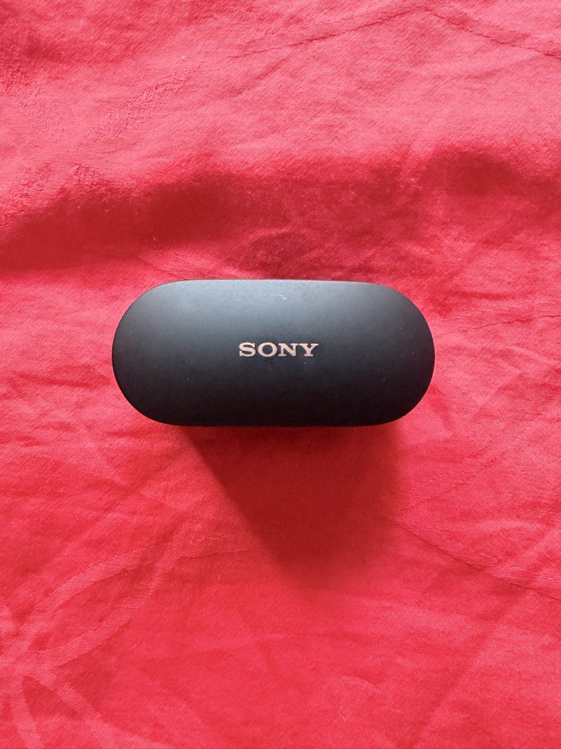 Sony WF-1000XM4 Wireless Earbuds (Category: Headphones & Headsets) located in San Pedro. Submitted by dennis697 (Listing ID 1469617639, Image 1). Description: - Model: Sony WF-1000XM4 (Black) - Includes: Charging case (USB-C port) and both earbuds - Condition: Standard daily wear on the casing, fully functional - Details: Model number and battery specs printed underneath the case - RFS: Upgraded / Decluttering - Meet-ups or shipping available via