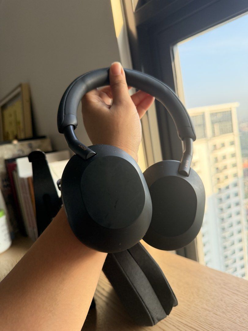 Sony WH-1000XM5 Wireless Headphones with Case (Category: Headphones & Headsets) located in Manila. Submitted by macannp (Listing ID 1469652473, Image 3). Description: - Item: Sony WH-1000XM5 Wireless Noise Cancelling Headphones - Color: Black - Condition: Good working order with normal signs of use on the matte finish. Slight Scratches on the earcup but sensor works pwrfectly fine - Inclusions: Original fabric carrying case only (headphone stand 