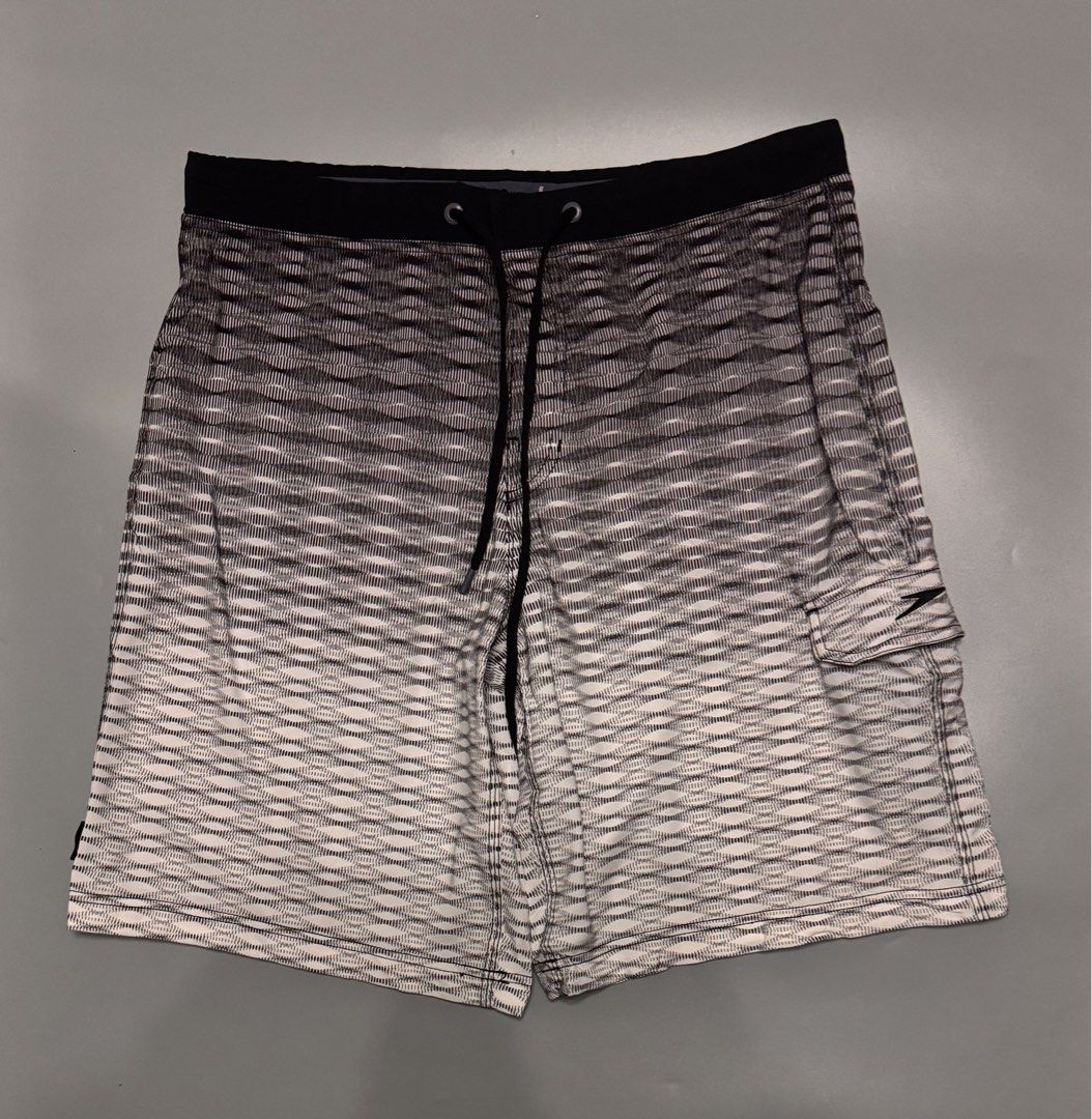 Speedo Board Shorts Men's Size 34 Black White Gradient (Category: Swim Trunks & Board Shorts) located in Alaminos. Submitted by outfitcheck.ph (Listing ID 1469698342, Image 1). Description: - Brand: Speedo - Style: Men's board shorts in a black and white gradient pattern - Size: 34 (tag inside waistband) - Features: Elastic drawstring closure, small side pocket on the right leg with Speedo logo - Fabric: Lightweight, ideal for swimming and beach 