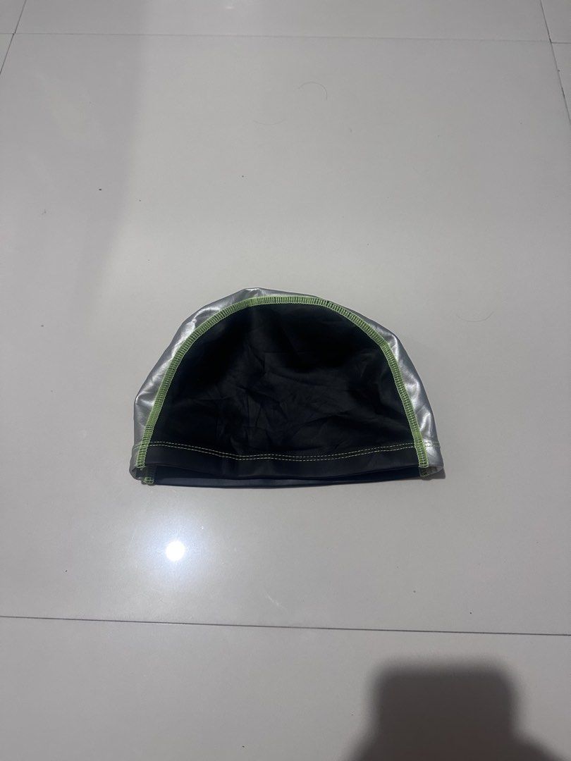 Speedo Swim Cap Black Silver Green (Category: Caps & Hats) located in Calamba. Submitted by thriftniyins (Listing ID 1469615881, Image 2). Description: - Brand: Speedo - Color: Black and silver with neon green stitching - Design: Distinct center stripe with white Speedo logo - Material: Polyurethane shell with polyester and spandex lining - Condition: Clean fabric, ready for the pool - plus sf.