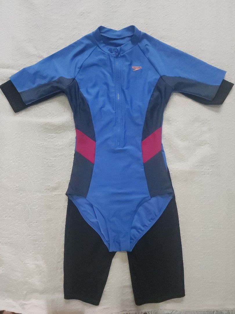 Speedo swimwear bundle two pieces (Category: Bikinis & Swimsuits) located in Mandaluyong City. Submitted by eayoh (Listing ID 1469616210, Image 2). Description: - Brand: Speedo - Quantity: 2-piece swimsuit bundle - Item 1: Full-length black and blue zip-front suit - Item 2: Blue, pink, and grey short-sleeve suit - Features: Front zippers for easy changing - Perfect for: Swimming lessons or beach days - Condition: Clean, excellent, and ready to us