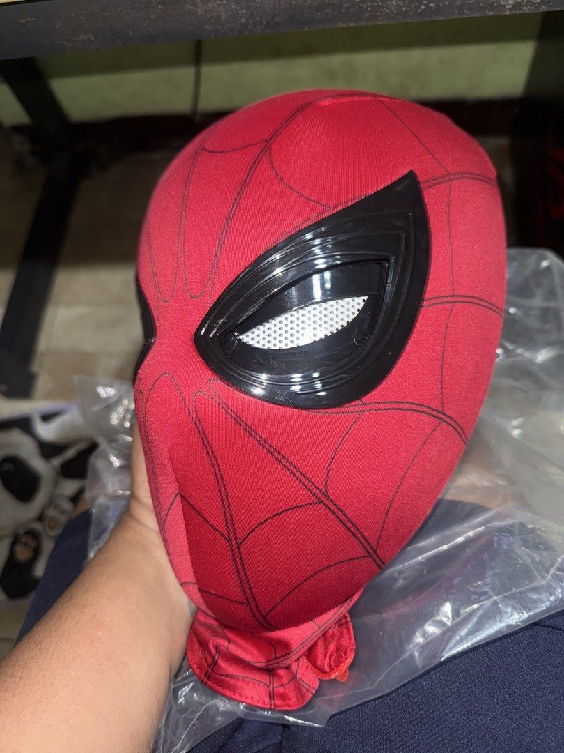 Spider-Man Cosplay Mask with Hard Shell and Face Shell (Category: Western Merchandise) located in Marikina City. Submitted by emmanasamy (Listing ID 1469720398, Image 2). Description: Once lang nagamit nung nanuod ng Premiere ng Home coming - Red Spider-Man costume mask with classic black web print lines - Includes a hard inner face shell to maintain a structured head shape - White mesh eyes with black frames for clear outward visibility - Conven