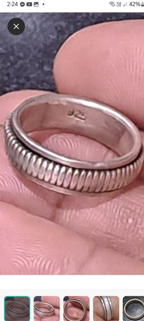 Spiner ring 925 Sterling Silver Spinner Ring Band (Category: Rings) located in Davao. Submitted by bravemoon_556cd5 (Listing ID 1469614230, Image 1). Description: - Material: Solid 925 sterling silver (stamped inside band) - Design: Center section spins smoothly with a textured ridged pattern - Fit: Solid weight and comfortable for everyday wear - Condition: Minor surface wear from regular use.