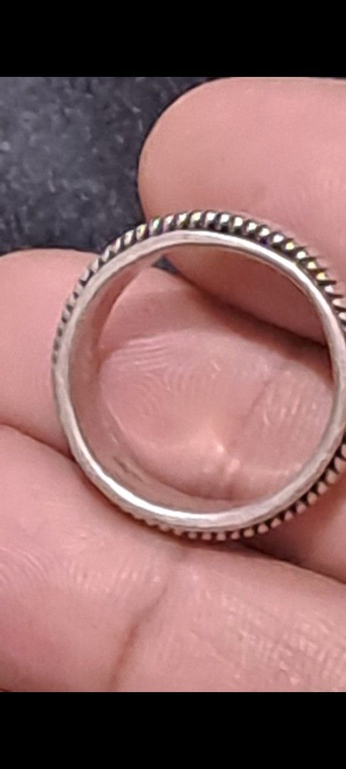 Spiner ring 925 Sterling Silver Spinner Ring Band (Category: Rings) located in Davao. Submitted by bravemoon_556cd5 (Listing ID 1469614230, Image 3). Description: - Material: Solid 925 sterling silver (stamped inside band) - Design: Center section spins smoothly with a textured ridged pattern - Fit: Solid weight and comfortable for everyday wear - Condition: Minor surface wear from regular use.