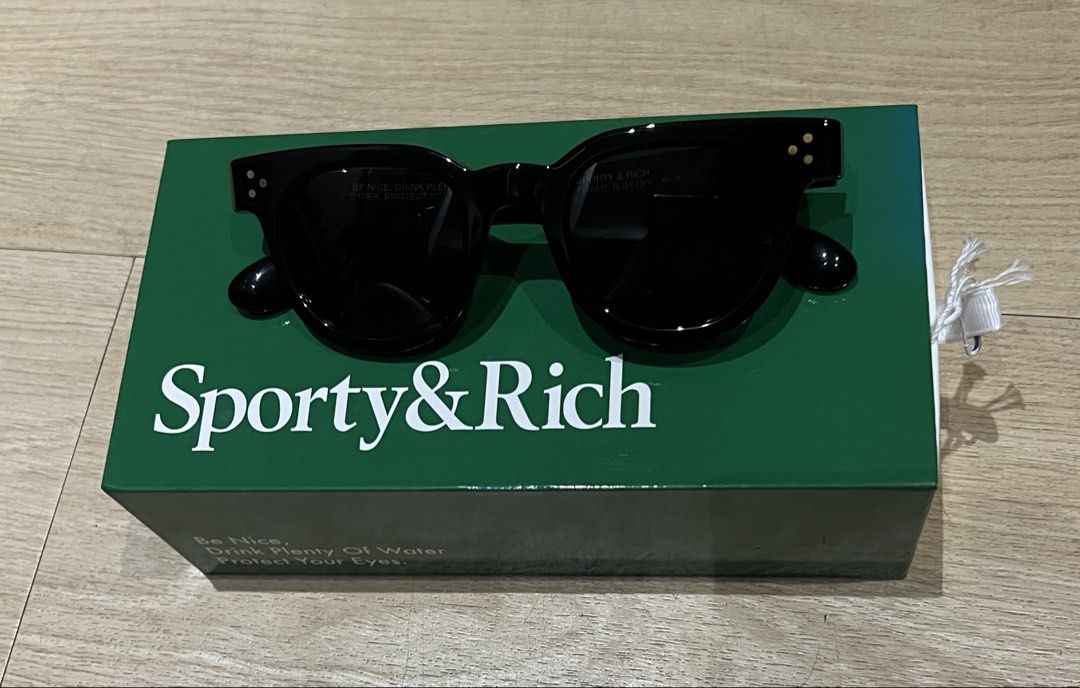 Sporty & Rich Round-Frame Sunglasses Black (Category: Sunglasses & Eyewear) located in Quezon City. Submitted by Zandee (Listing ID 1469620170, Image 1). Description: - Brand: Sporty & Rich - Style: Round-frame sunglasses in classic black acetate - Lenses: Dark lenses with subtle gold-tone hardware on temples and hinges - Condition: Brand new / Never worn out, kept safely in case - Inclusions: Original dark green branded storage box.