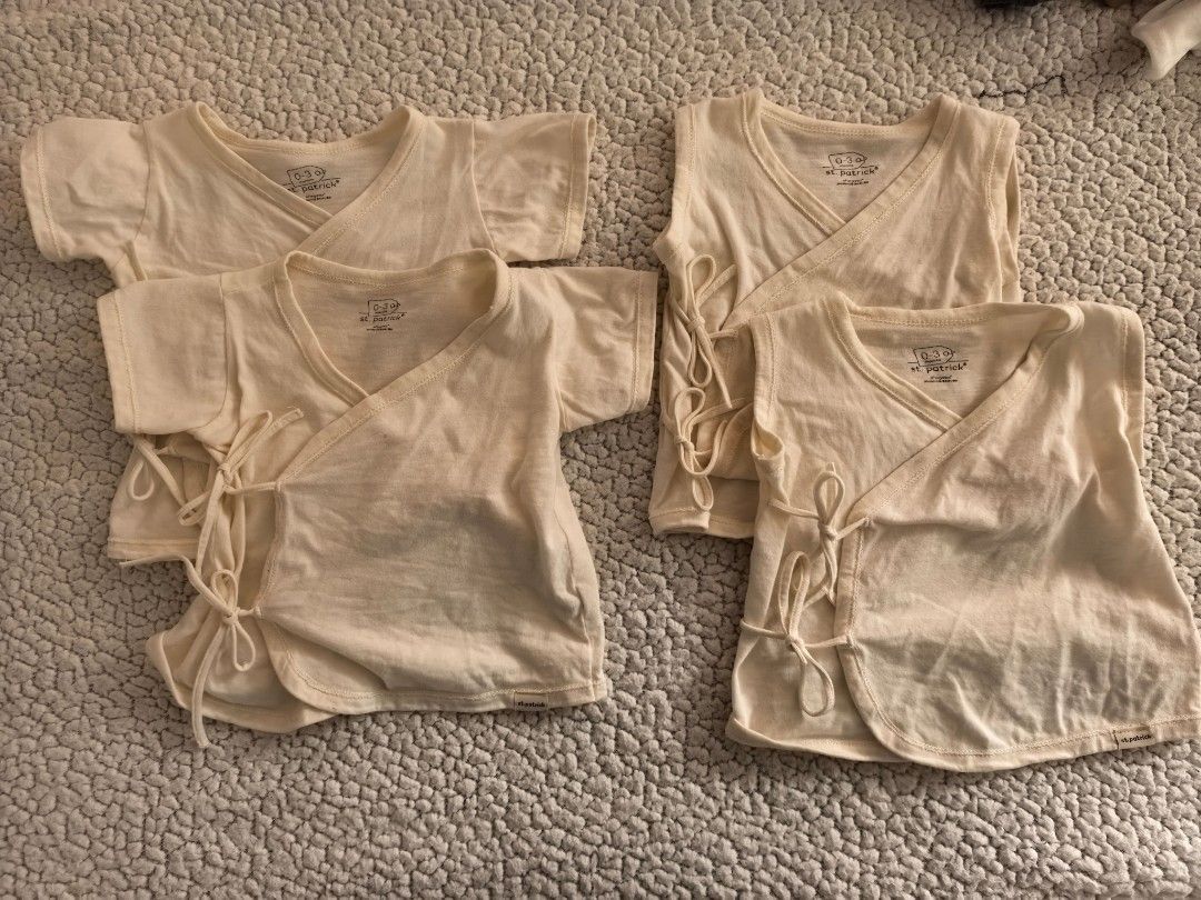 St. Patrick baby tie side tops bundle 0-3 months (Category: Babies & Kids Fashion) located in Manila. Submitted by euladelosr38638 (Listing ID 1469651590, Image 1). Description: - Brand: St. Patrick - Quantity: Bundle of 4 baby tops - Size: 0-3 months - Color: Cream - Material: Soft cotton - Design: Wrap-around style with side ties for easy dressing - Condition: Clean and well-cared for - Perfect essential basic pieces for newborns Can ship throu