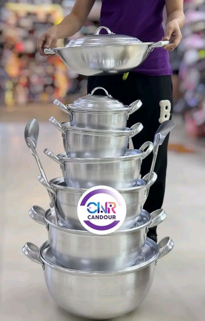 Stackable Aluminum Cooking Pot and Wok Set (Category: Cookware & Accessories) located in Quezon City. Submitted by marecel146 (Listing ID 1469618932, Image 2). Description: - Complete stackable aluminum cooking set with multiple pot sizes, matching lids, and ladles - Lightweight and heavy-duty metal construction for easy large-scale meal preparation - Space-saving nesting design allows all pieces to stack neatly into one compact tower - Ideal for