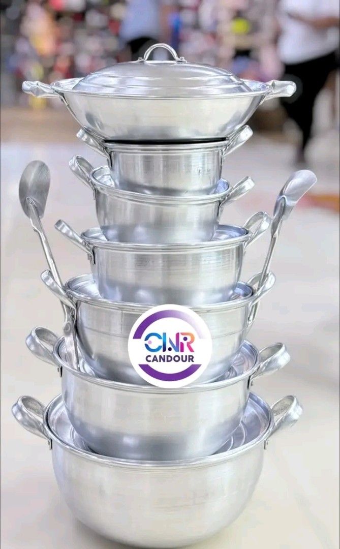 Stackable Aluminum Cooking Pot and Wok Set (Category: Cookware & Accessories) located in Quezon City. Submitted by marecel146 (Listing ID 1469618932, Image 1). Description: - Complete stackable aluminum cooking set with multiple pot sizes, matching lids, and ladles - Lightweight and heavy-duty metal construction for easy large-scale meal preparation - Space-saving nesting design allows all pieces to stack neatly into one compact tower - Ideal for