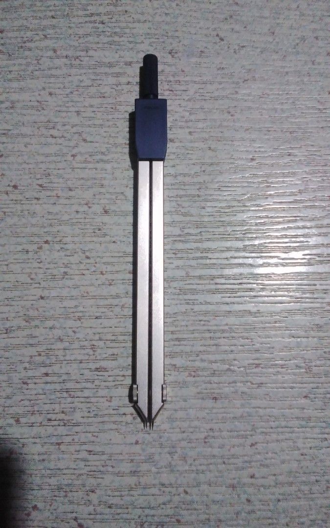 Staedler (Category: Stationery & School Supplies) located in Quezon City. Submitted by Bernz (Listing ID 1469676522, Image 3). Description: Brand: Staedtler Model: Ciclo / 554 Type: Precision geometry and technical drawing compass Material: Metal construction with a blue plastic top handle/mechanism Use: Drafting, technical drawing, and geometry work for students or professionals..