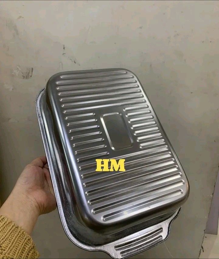 Stainless Steel Roasting Pan with Lid and Handles (Category: Cookware & Accessories) located in Quezon City. Submitted by marecel146 (Listing ID 1469580607, Image 1). Description: - Material: Durable stainless steel with a shiny metallic finish - Design: Includes a ribbed lid and built-in side handles for safe carrying - Versatile: Great for oven-baking meats and vegetables - Easy Maintenance: Smooth surface allows for quick and easy cleaning aft