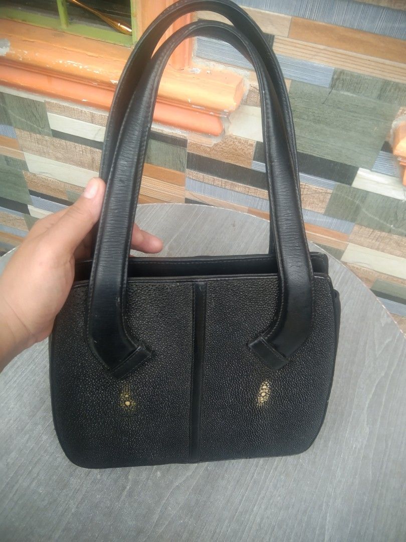 Stingray (Category: Shoulder Bags) located in Manila. Submitted by mysticshark-0a05e9 (Listing ID 1469754411, Image 3). Description: - Stylish structured black handbag that holds its shape well - Textured faux leather side panels with smooth black top handles - 2 main compartments separated by a secure central zip pocket - Convenient gold-tone snap closure - Roomy interior for your phone, keys, wallet, and everyday essentials.