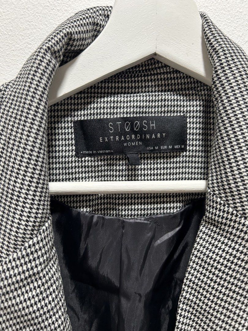 Stoosh Houndstooth Blazer Jacket Women Size M (Category: Coats, Jackets and Outerwear) located in Manila. Submitted by isabelle_1104 (Listing ID 1469645336, Image 3). Description: - Brand: Stoosh - Style: Black and white houndstooth blazer - Size: Medium (Made in Vietnam) - Features: Classic lapel collar, single-button closure, functional front pockets, and ruched 3/4 sleeves - Fit: Tailored fit with structured shoulders and fully lined interior 