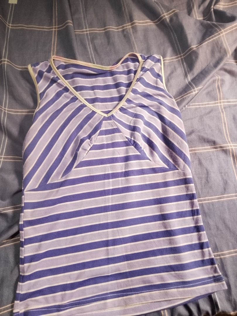 Striped sleeveless top (Category: Sleeveless) located in Caloocan City. Submitted by anythingshewants (Listing ID 1469683573, Image 1). Description: Purple striped sleeveless top, lightly used,free shipping.
