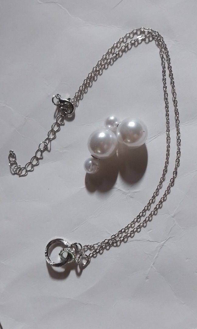 Student necklace accessories Color: Silver (Category: Necklaces) located in Batangas. Submitted by zenrez_shop (Listing ID 1469641347, Image 2). Description: Buy 1 Necklace and get 1 pearl earring Hypoallergenic student necklace accessories.