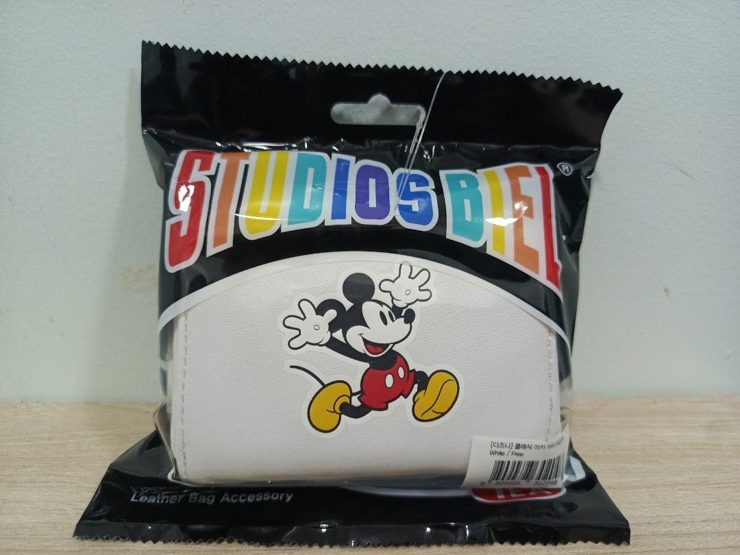 Studios Biel Mickey Mouse Card Holder (Category: Wallets & Card holders) located in Carmona. Submitted by itchan21 (Listing ID 1469678586, Image 1). Description: Original Price 138,000 korean won - Brand: Studios Biel - Material: Premium faux leather - Condition: Factory sealed, brand new in original black packaging - Designs available: White classic Mickey, black surfing Mickey, and blue Tigger 100 edition - Usage: Practical daily card holder an