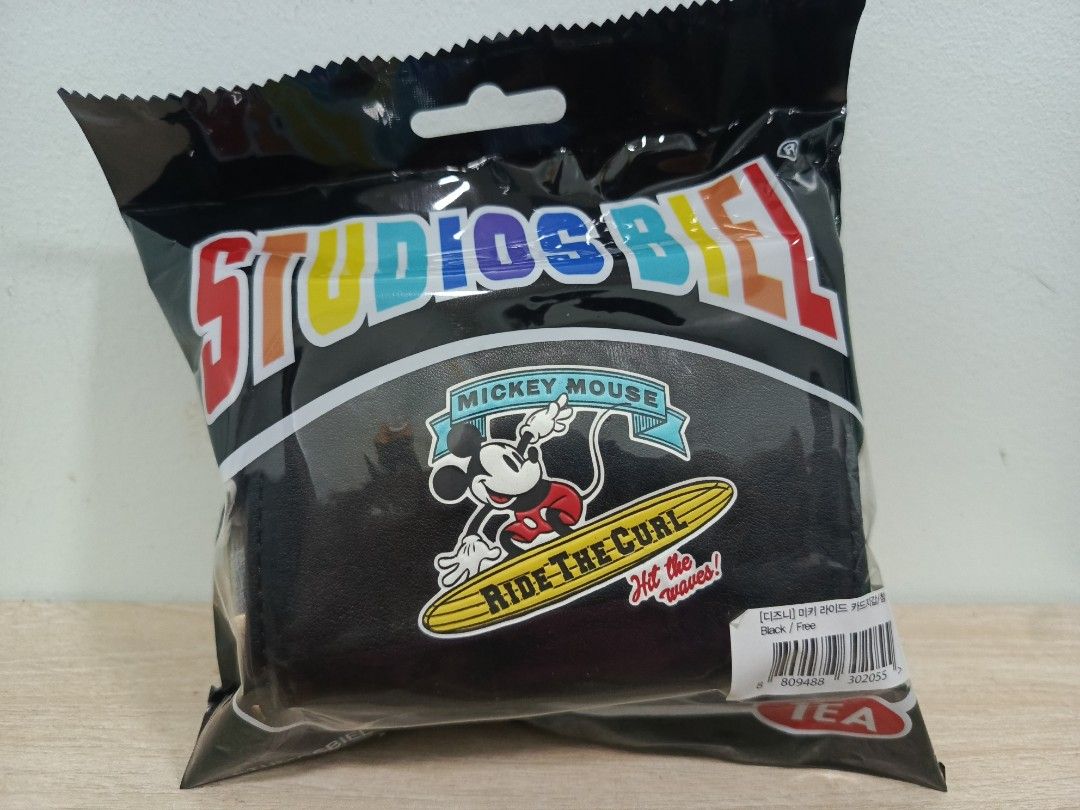 Studios Biel Mickey Mouse Card Holder (Category: Wallets & Card holders) located in Carmona. Submitted by itchan21 (Listing ID 1469678586, Image 3). Description: Original Price 138,000 korean won - Brand: Studios Biel - Material: Premium faux leather - Condition: Factory sealed, brand new in original black packaging - Designs available: White classic Mickey, black surfing Mickey, and blue Tigger 100 edition - Usage: Practical daily card holder an