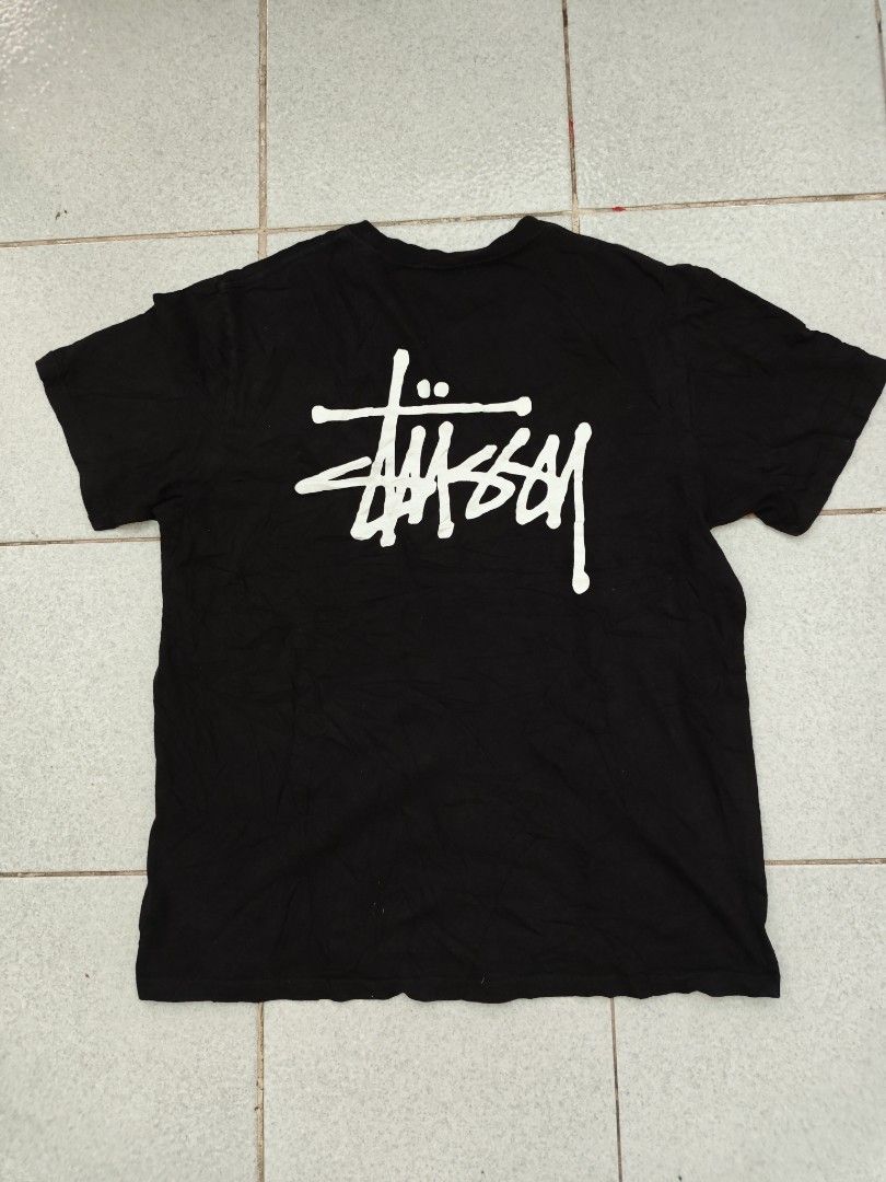 Stussy Black Tee with White Logo Size M (Category: Tshirts & Polo Shirts ) located in Isulan. Submitted by jaysthrift (Listing ID 1469596863, Image 2). Description: - Brand: Stussy -21x27 -issue crack prints - Color: Classic Black 9.5/10 - Size: Medium - Material: 100% Cotton (Made in Mexico) - Design: Small chest logo and large white back graphic - Fit: Short sleeves, crew neck - Condition: Great everyday streetwear piece.