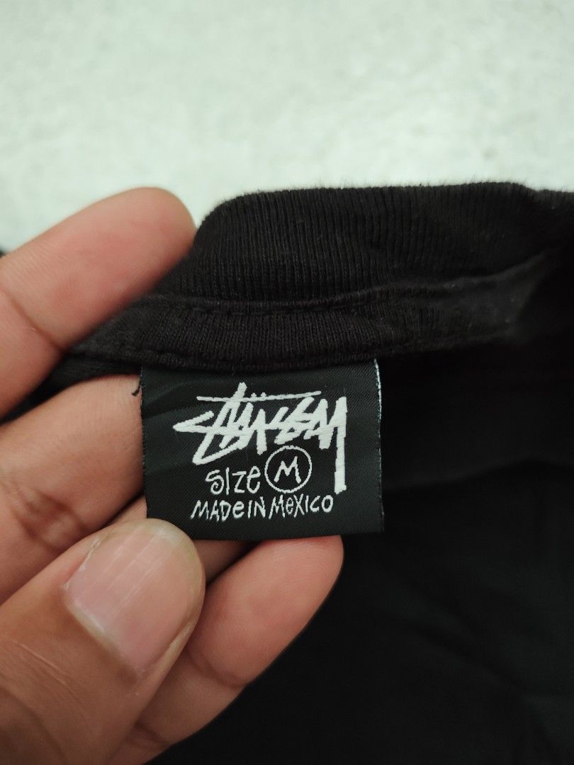 Stussy Black Tee with White Logo Size M (Category: Tshirts & Polo Shirts ) located in Isulan. Submitted by jaysthrift (Listing ID 1469596863, Image 3). Description: - Brand: Stussy -21x27 -issue crack prints - Color: Classic Black 9.5/10 - Size: Medium - Material: 100% Cotton (Made in Mexico) - Design: Small chest logo and large white back graphic - Fit: Short sleeves, crew neck - Condition: Great everyday streetwear piece.