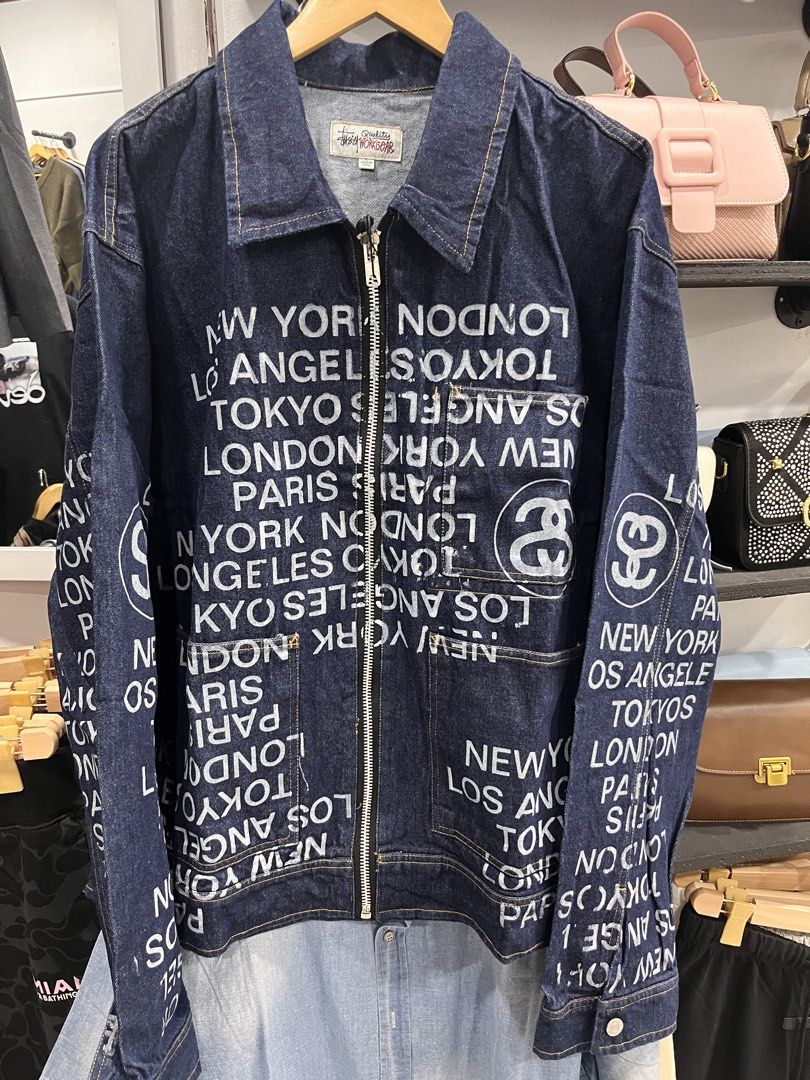 Stussy Quality Workgear Denim Zip Jacket (Category: Coats, Jackets and Outerwear) located in Manila. Submitted by style_hoods (Listing ID 1469624960, Image 1). Description: - Brand: Stussy Quality Workgear - Style: Denim jacket with all-over global city print (New York, Los Angeles, Tokyo, London, Paris) - Color: Dark blue with contrast stitching - Size: Large - Closure: Full front YKK metal zipper - Pockets: Left chest pocket with button flap - 