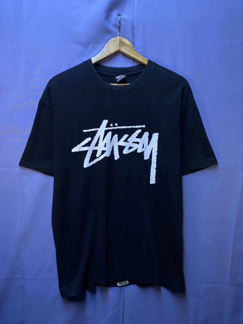 STUSSY “SURF MAN” SINGAPORE (Category: Tshirts & Polo Shirts ) located in Makati City. Submitted by drip.poww (Listing ID 1469735269, Image 2). Description: - Authentic Stussy - Color: Black - Size: Large - Dimes: 22.5x30 - Authentic - Excellent condition - Need wash, fresh from bale - Material: 100% Cotton Please don’t expect too much—these are thrifted (ukay) items. 😊 !!STILL NEGOTIABLE!!.