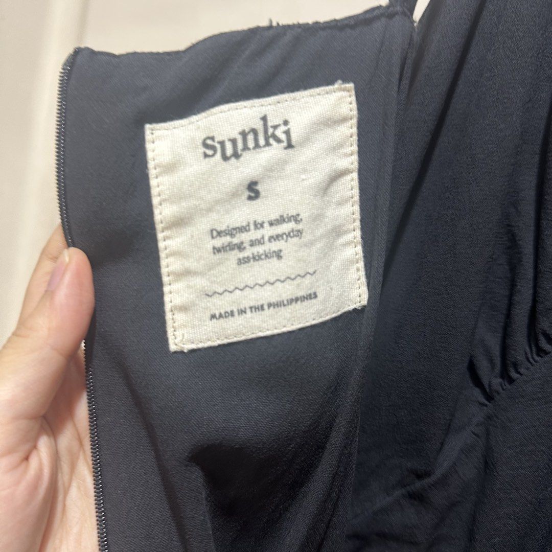 Sunki - Black Cami Asymmetrical Dress (Category: Dresses) located in Muntinlupa City. Submitted by pickjes (Listing ID 1469720895, Image 3). Description: Brand: Sunki Label Size: Small Color: Black Condition: Used max 3x. Small tear at the top of back zip down (see last photo). Pocket stitchings also slightly loose. RFS: No longer fits my hips Original price ₱2,990 Black cami slip dress featuring a V-neckline and a distinct asymmetrical handkerch
