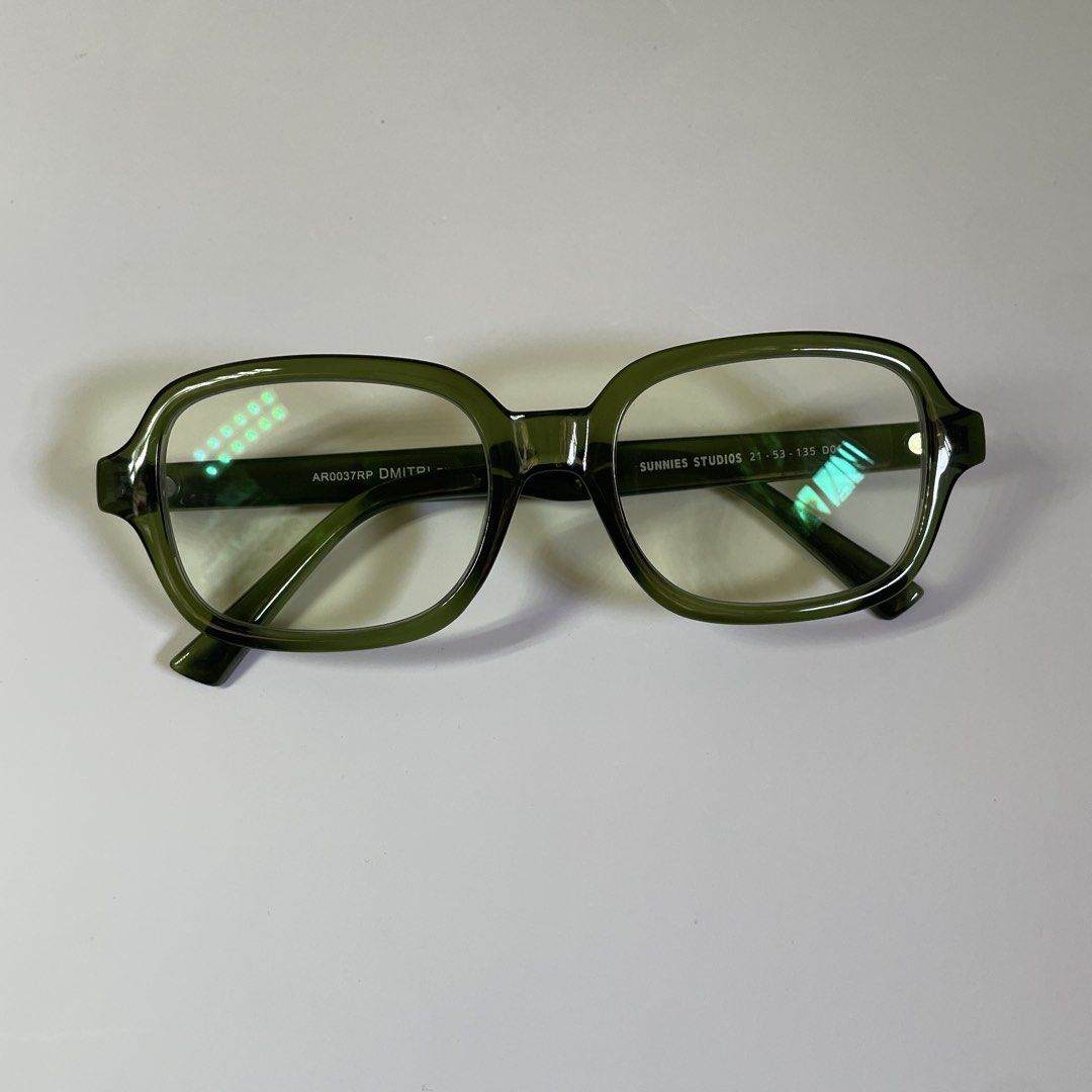 Sunnies Studios Dmitri Pine Green Eyeglasses (Category: Sunglasses & Eyewear) located in Caloocan City. Submitted by swiftcloud506 (Listing ID 1469621943, Image 1). Description: - Brand/Model: Sunnies Studios Dmitri (AR0037RP) - Color: Pine Green with a glossy finish - Frame Style: Chunky square acetate - Lenses: Clear (ideal for everyday optical use or custom blue light lenses) - no case included rfs: tried on only, di bagay yung frame.