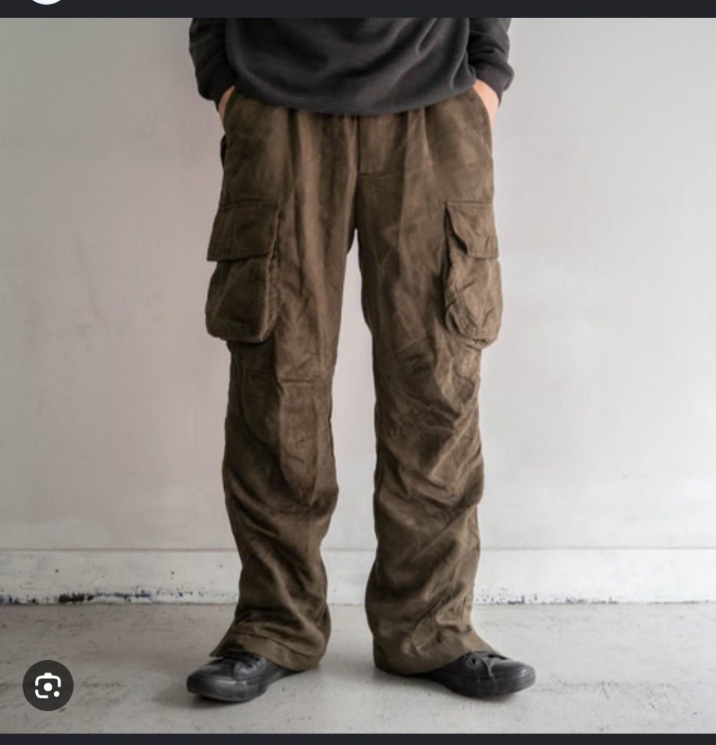 Sunny Clouds Brown Herringbone Cargo Pants (Category: Trousers) located in Imus. Submitted by darylg88358770 (Listing ID 1469651983, Image 1). Description: - Brand: Sunny Clouds - Color: Brown - Fit: Relaxed fit style with button fly closure - Fabric: Herringbone texture throughout with patterned inner waistband lining - Storage: Multiple functional utility pockets on sides and back - Details: Adjustable drawstring cuffs at the bottom hem the ite