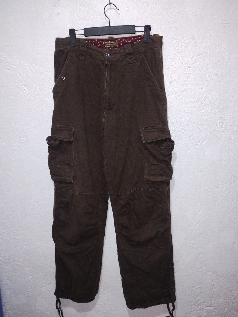 Sunny Clouds Brown Herringbone Cargo Pants (Category: Trousers) located in Imus. Submitted by darylg88358770 (Listing ID 1469651983, Image 3). Description: - Brand: Sunny Clouds - Color: Brown - Fit: Relaxed fit style with button fly closure - Fabric: Herringbone texture throughout with patterned inner waistband lining - Storage: Multiple functional utility pockets on sides and back - Details: Adjustable drawstring cuffs at the bottom hem the ite