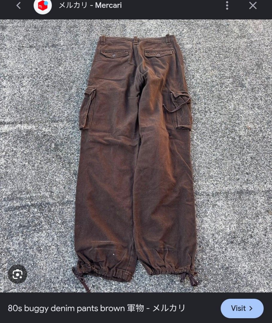 Sunny Clouds Brown Herringbone Cargo Pants (Category: Trousers) located in Imus. Submitted by darylg88358770 (Listing ID 1469651983, Image 2). Description: - Brand: Sunny Clouds - Color: Brown - Fit: Relaxed fit style with button fly closure - Fabric: Herringbone texture throughout with patterned inner waistband lining - Storage: Multiple functional utility pockets on sides and back - Details: Adjustable drawstring cuffs at the bottom hem the ite