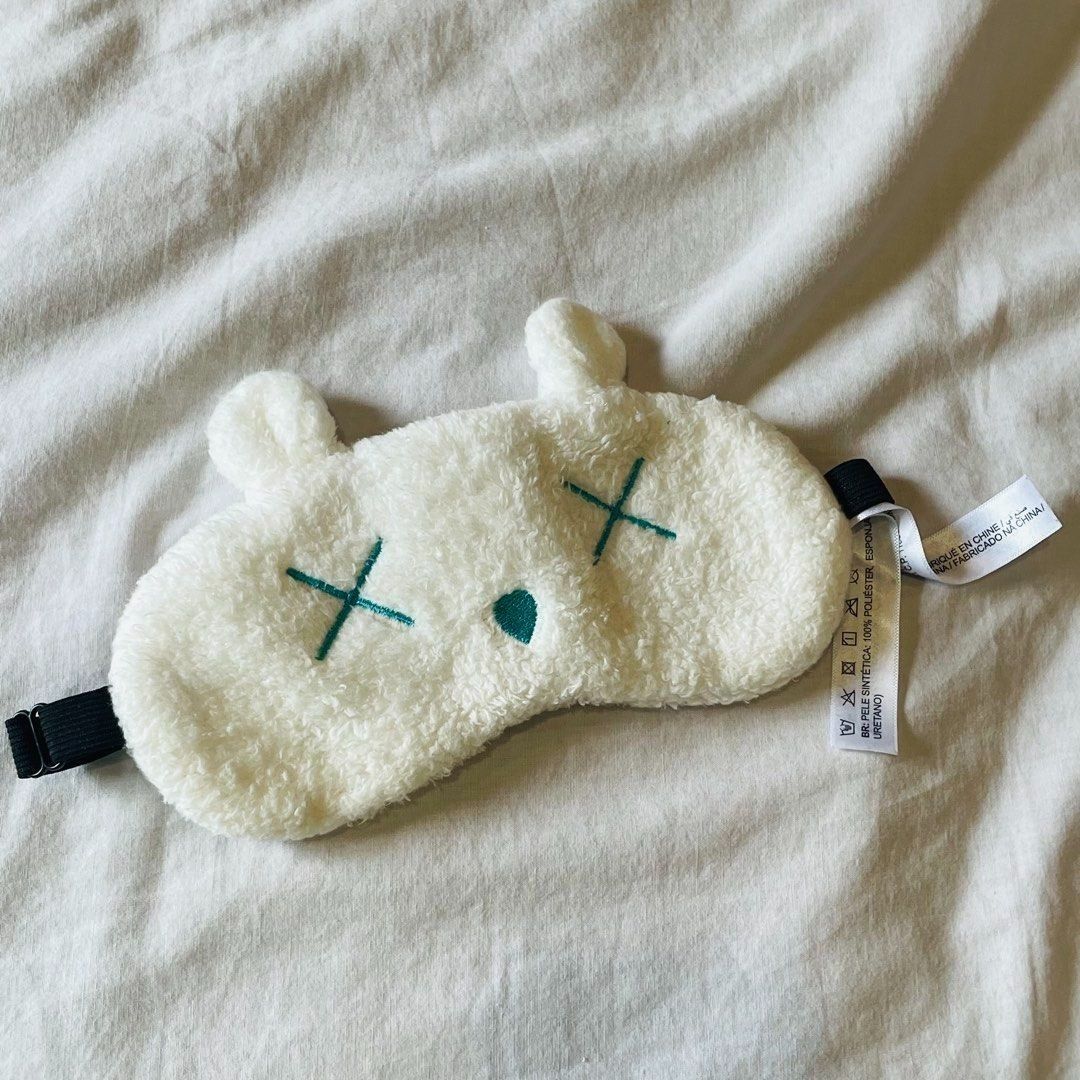 Super Cute! Miniso Fluffy Bear Eye Mask (Category: Face Care) located in Quezon City. Submitted by travelstylelove (Listing ID 1469625507, Image 2). Description: - Brand new with tags in original plastic pouch - Super soft white fleece fabric - Cute embroidered green X eyes and nose design - Comfortable, adjustable black elastic strap - Ideal for travel or sleeping at home.